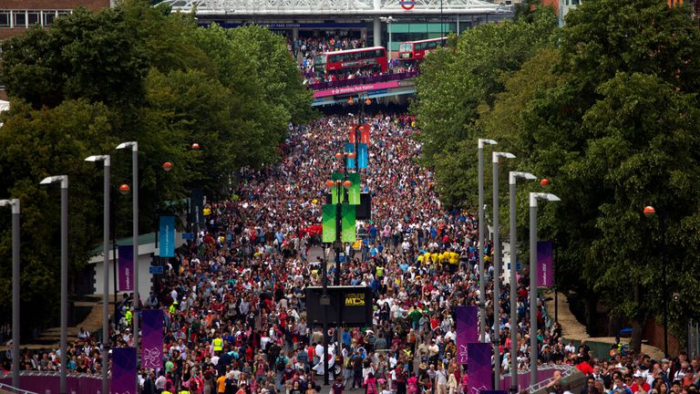 Crowds make their way toward Wembley Stadium during the London 2012 Olympics