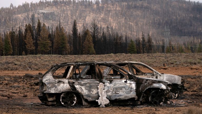 The remnants of cars destroyed by the Bootleg Fire are seen in a small community near Beatty, Oregon, U.S., July 19, 2021. REUTERS/David Ryder
