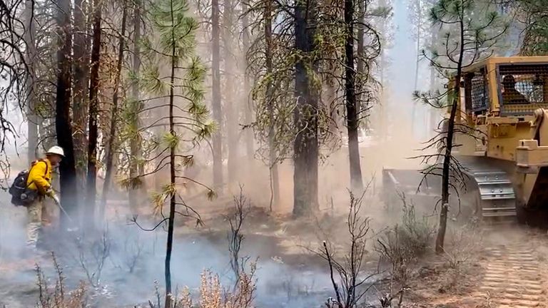 Firefighters battle the Bootleg Fire in southern Oregon