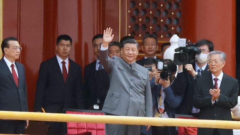 Chinese President Xi Jinping waves next to Premier Li Keqiang and former president Hu Jintao at the end of the event marking the 100th founding anniversary of the Communist Party of China, on Tiananmen Square in Beijing, China July 1, 2021. REUTERS/Carlos Garcia Rawlins
