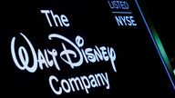 A screen shows the logo and a ticker symbol for The Walt Disney Company on the floor of the New York Stock Exchange (NYSE) in New York, U.S., December 14, 2017