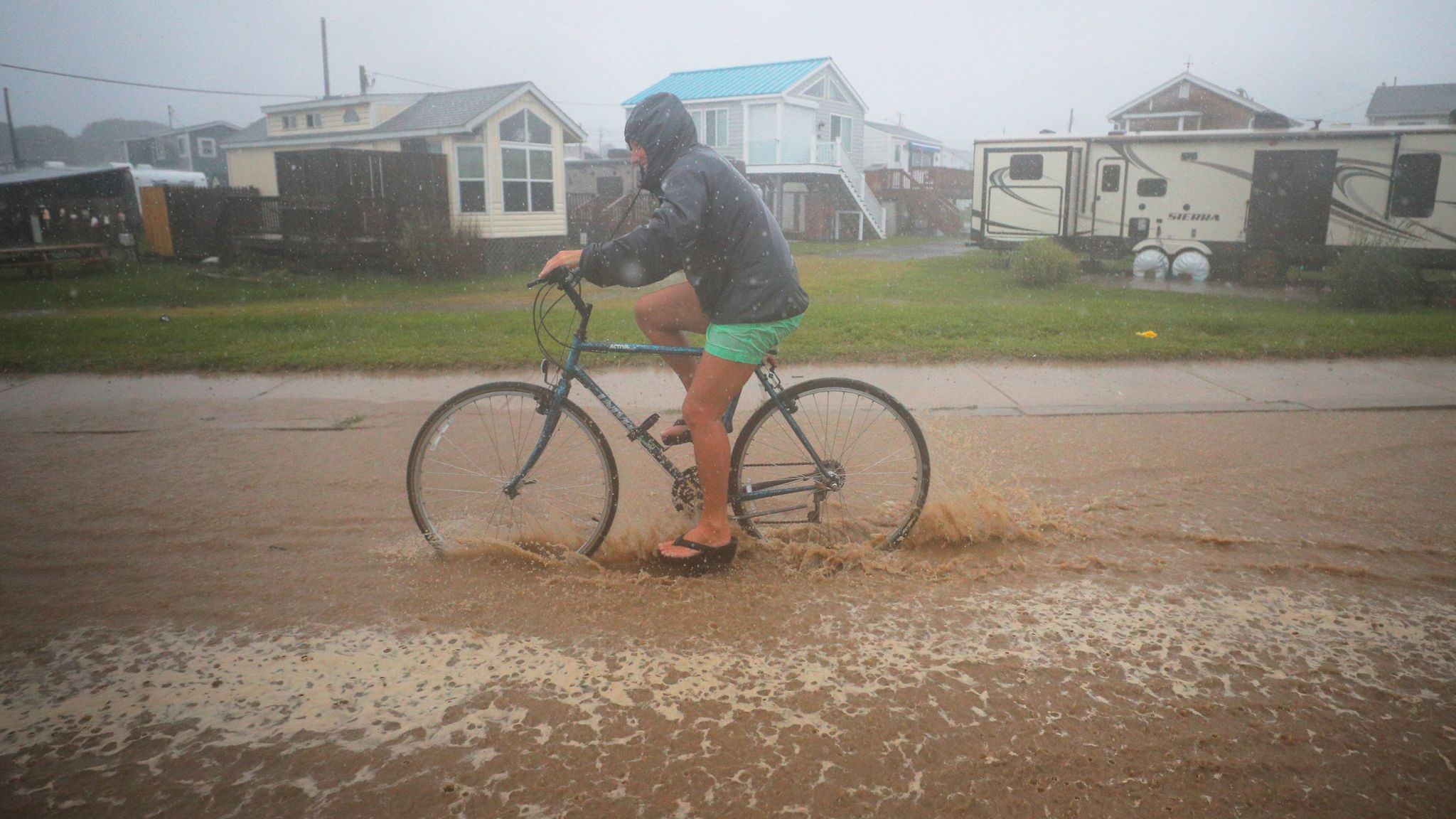 Storm Henri brings strong winds and heavy rain as it makes landfall on ...
