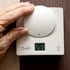 Jane Burney 94, from Childwall alters the thermostat in her home. The start of winter effects pensioners with concerns over heating bills PRESS ASSOCIATION Photo. Issue date: Wednesday November 19, 2014. See PA story . Photo credit should read: Peter Byrne/PA Wire