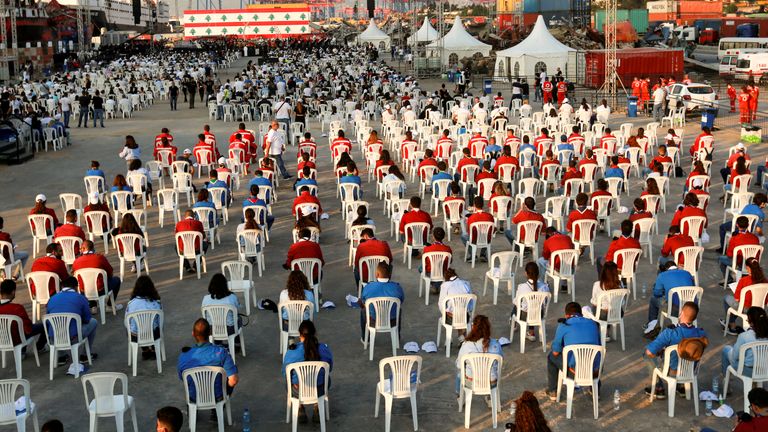People attend a mass in memory of the victims as Lebanon marks one-year anniversary of Beirut port explosion, at the port in Beirut, Lebanon August 4, 2021. REUTERS/Aziz Taher
