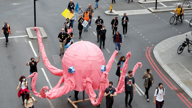 Extinction Rebellion climate activists take part in a protest in London, Britain August 28, 2021. REUTERS/Peter Nicholls