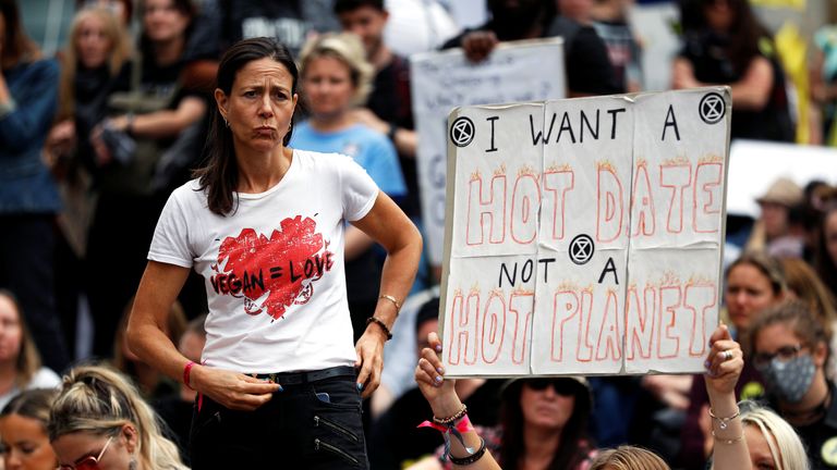 Extinction Rebellion climate activists take part in a protest in London, Britain August 28, 2021. REUTERS/Peter Nicholls