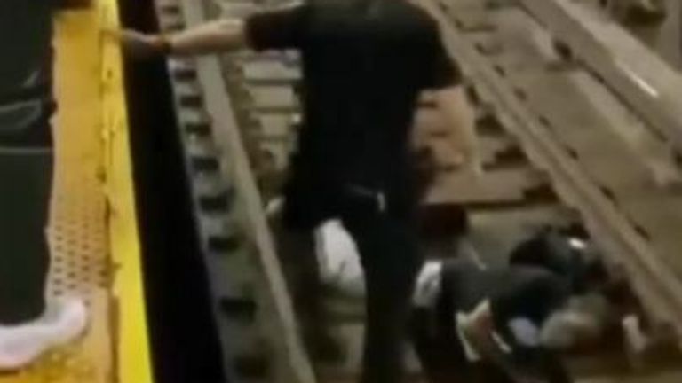 Video posted on the NYPD news twitter account shows a man being lifted back onto the platform after falling onto the tracks.