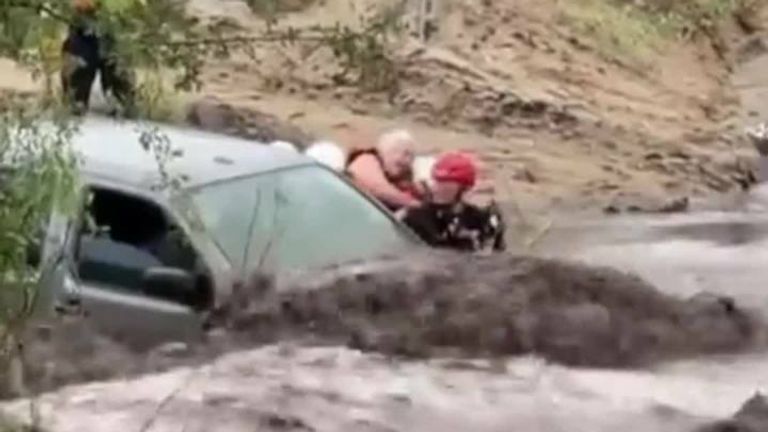 Drivers were saved from rapid flowing waters by rescue crews after flash floods hit Pima County, Arizona.