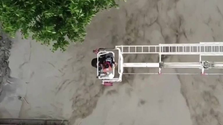 Drone footage shows a woman being rescued after flash floods in Kastamonu in northern Turkey