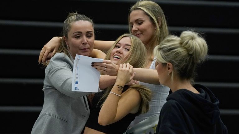 Faith Bryant (back) and Abbie Hollis (front) are hugged at Archbishop Blanch School in Liverpool, as students receive their A-Level results. Picture date: Tuesday August 10, 2021.