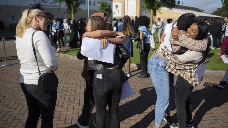 Students celebrate at Brampton Manor Academy in London, as they receive their A-Level results
