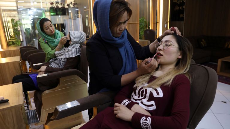 Beauticians apply makeup on customers at Ms. Sadat’s Beauty Salon in Kabul, Afghanistan, Sunday, April 25, 2021. Kabul&#39;s young working women say they fear their dreams may be short-lived if the Taliban return to Kabul, even if peacefully as part of a new government. Credit: AP