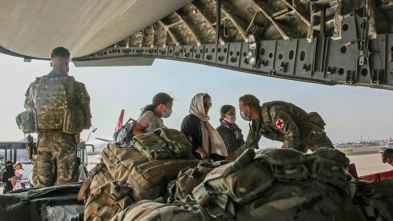 British citizens and dual nationals residing in Afghanistan board a military plane for evacuation from Kabul airport, Afghanistan August 16, 2021, in this handout picture obtained by Reuters on August 17, 2021. LPhot Ben Shread/UK MOD Crown copyright 2021/Handout via REUTERS THIS IMAGE HAS BEEN SUPPLIED BY A THIRD PARTY. MANDATORY CREDIT. NO RESALES. NO ARCHIVES. FACES BLURRED AT SOURCE