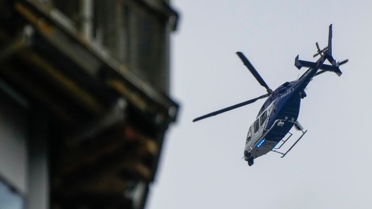 A police helicopter patrols the sky in Sydney as the city sees a continued rise in COVID-19 cases. Pic AP