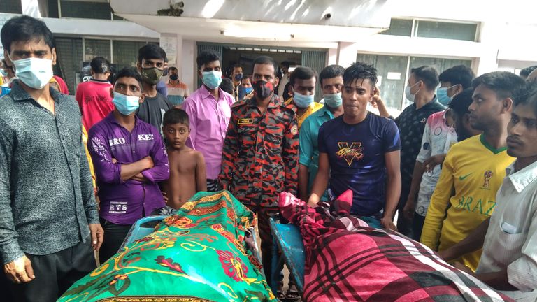 People gather around bodies of victims after lightning killed more than a dozen people in Shibganj in Chapainawabganj district. Pic: AP