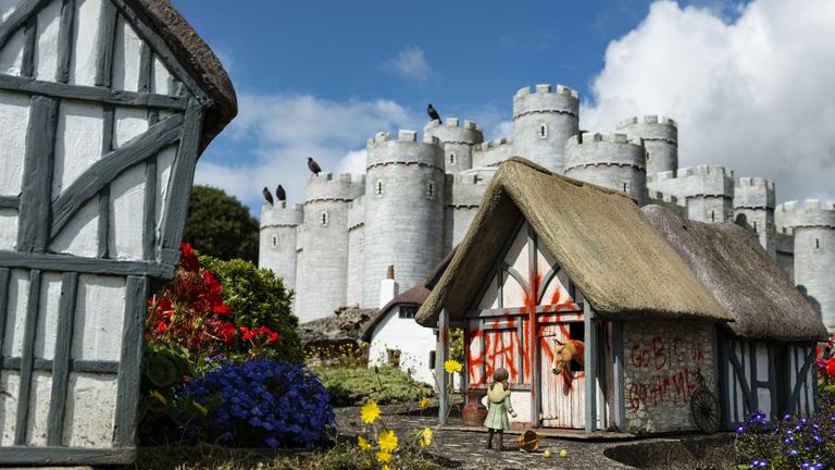 One of the new works by Banksy, on one of the model houses in the Merrivale Model Village