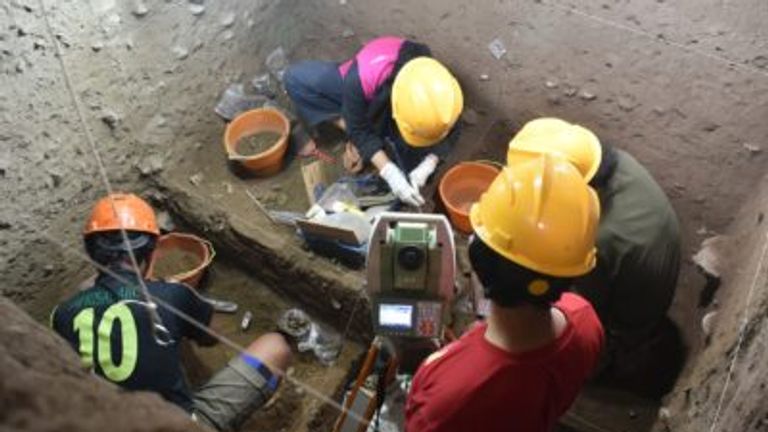 Archaeologists excavate at Leang Panninge cave on Sulawesi. Pic: Leang Panninge Research Project