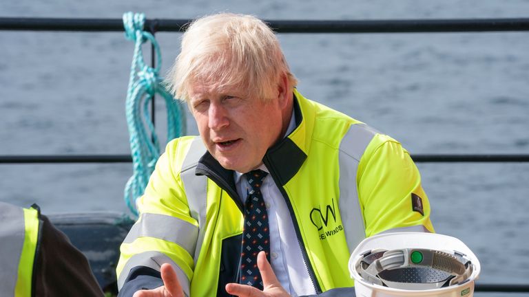 British Prime Minister Boris Johnson gestures as he meets members of the crew onboard the Esvagt Alba during a visit to the Moray Offshore Windfarm East off the Aberdeenshire coast, during his visit to Scotland, Britain, August 5, 2021. Jane Barlow/Pool via REUTERS