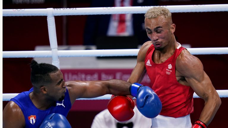 Arlen Lopez, of Cuba (left) punches Benjamin Whittaker (right) during their light heavy weight 75-81kg finals boxing match. Pic: AP