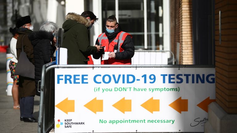 People queue outside a coronavirus disease (COVID-19) test centre at London Bridge Station