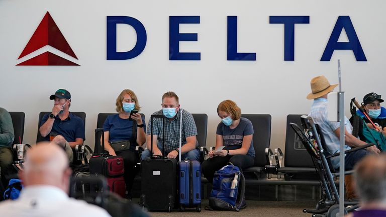 Delta Air Line workers will need to pay $200 (£149) extra a month to their health insurance. Pic: AP