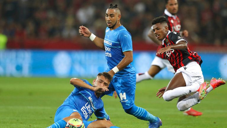 Dimitri Payet (C) was struck with a bottle by Nice fans