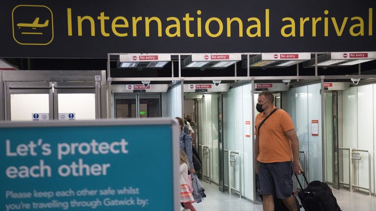 Passengers arrive at Gatwick Airport, West Sussex, before Tuesday&#39;s 4am requirement for travellers arriving from Portugal to quarantine for 10 days comes into force. Picture date: Monday June 7, 2021.