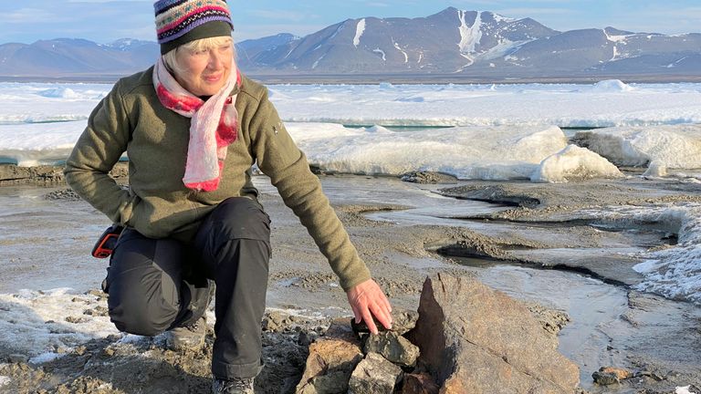 An undated handout image of Swiss entrepreneur Christiane Leister, creator of the Leister Foundation that financed an expedition which discovered a tiny island off the coast of Greenland which they say is the world&#39;s northernmost point of land, in front of a cairn in which expedition members left a message with details of their visit. Pic: Julian Charriere/via REUTERS THIS IMAGE HAS BEEN SUPPLIED BY A THIRD PARTY. 