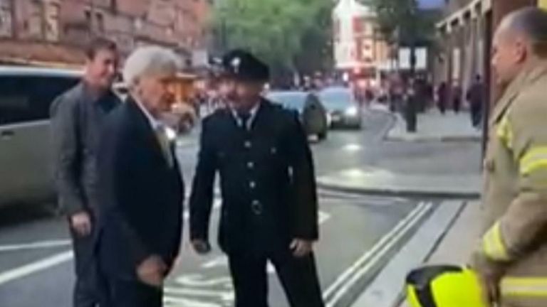 Harrison Ford congratulates a London firefighter on his retirement