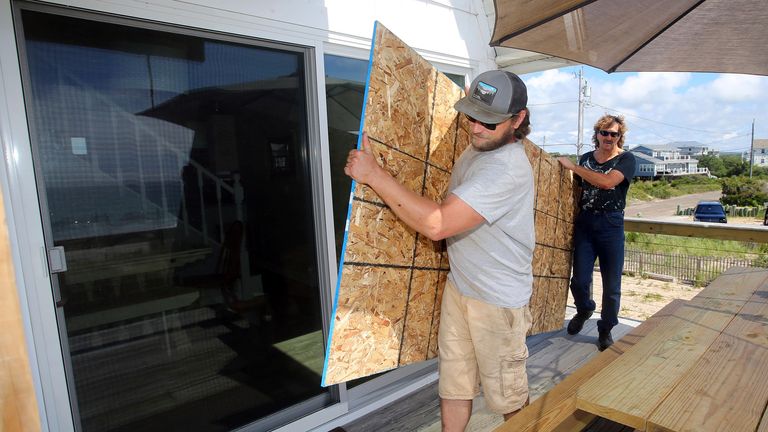 People in Rhode Island boarded up windows as they brace for Hurricane Henri to hit. Pic AP