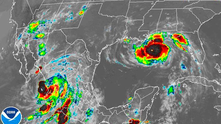 Ida (right) is due to hit as Nora (lower left) travels northward up Mexico&#39;s Pacific Coast (Pic NOAA via AP)