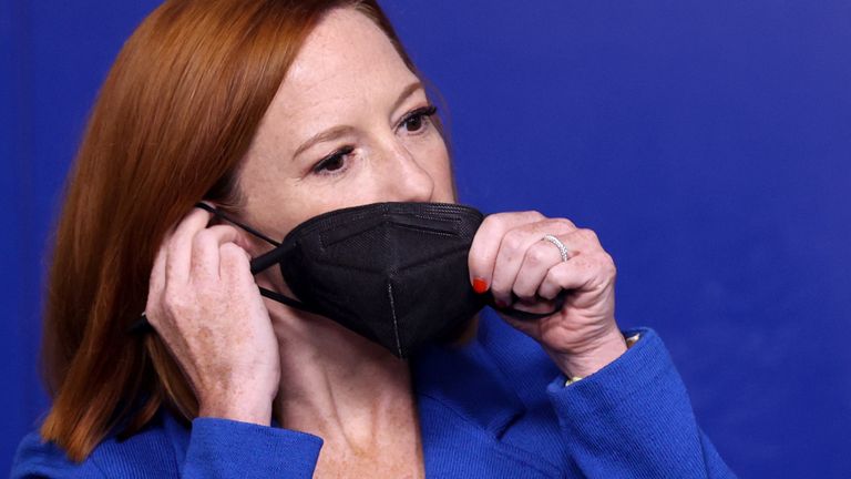 Press Secretary Jen Psaki adjusts her mask during the daily press briefing 