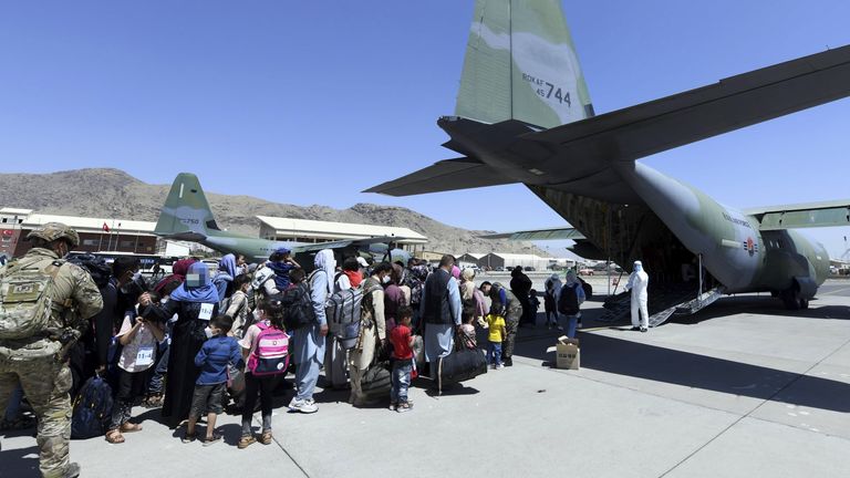 Afghan co-workers and their families board a C-130J plane of the South Korean Air Force at an airport in Kabul during an evacuation operation. Pic: South Korean Defense Ministry/ZUMA Press Wire/Shutterstock