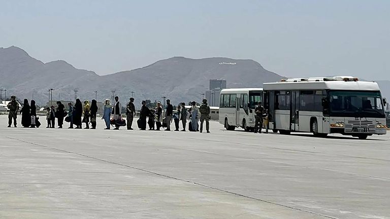 People are evacuated from Hamid Karzai International Airport in Kabul, Afghanistan. Pic: Hassan Majeed/UPI/Shutterstock