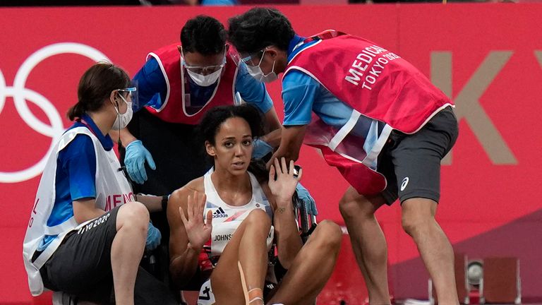 Katarina Johnson-Thompson, of Britain, reacts after dropping to the track. Pic: AP