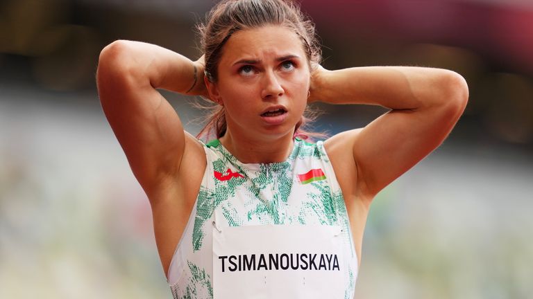 Krystsina Tsimanouskaya of Belarus reacts after competing in Heat 6 of the women&#39;s 100m at the Tokyo Olympics