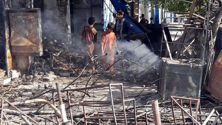 Fighting between Taliban and Afghan security forces in Kunduz destroyed buildings and shops. Pic: AP
