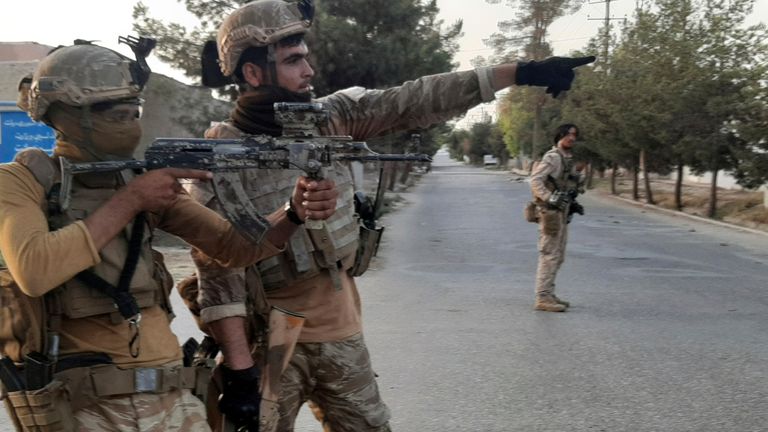 Afghan Special forces patrol a deserted street during fighting between Taliban and Afghan security forces, in Lashkar Gah, Helmand province, southern Afghanistan, Tuesday, Aug. 3, 2021. The Taliban pressed on with their advances in Afghanistan&#39;s southern Helmand province on Tuesday as Afghan forces launched airstrikes to defend the provincial capital. (AP Photo/Abdul Khaliq)