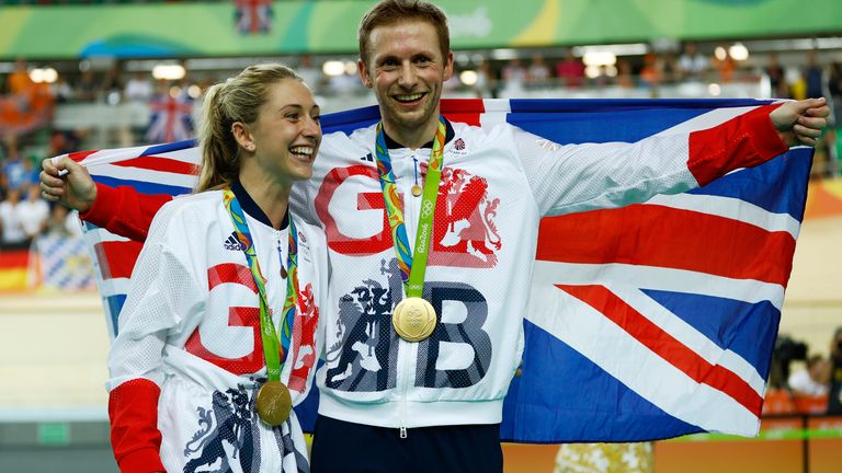 Laura Trott, left, and her fiance Jason Kenny, right, both of Britain, pose with their gold medals at the Rio Olympic Velodrome during the 2016 Summer Olympics in Rio de Janeiro, Brazil, Tuesday, Aug. 16, 2016. Kenny won the men&#39;s keirin cycling final and Trott won gold in the women&#39;s omnium race.(AP Photo/Patrick Semansky)