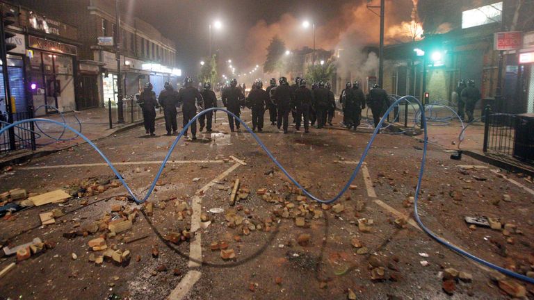 Riot police form a line in Tottenham, north London