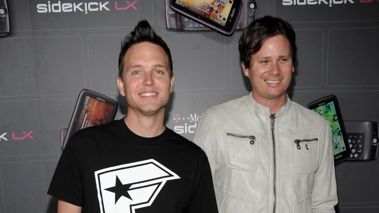Singer and musician Mark Hoppus, left, and musician Tom DeLonge of rock band Blink-182 arrive at the T-Mobile Sidekick LX Launch Party in Los Angeles on Thursday, May 14, 2009. (AP Photo/Dan Steinberg)
