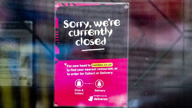 A sign on the doors of a branch of Nando&#39;s in White City, Manchester, telling customers that the store is closed. The chain has had to temporarily close around 50 of its restaurants nationwide after running out of peri-peri chicken. Picture date: Wednesday August 18, 2021.