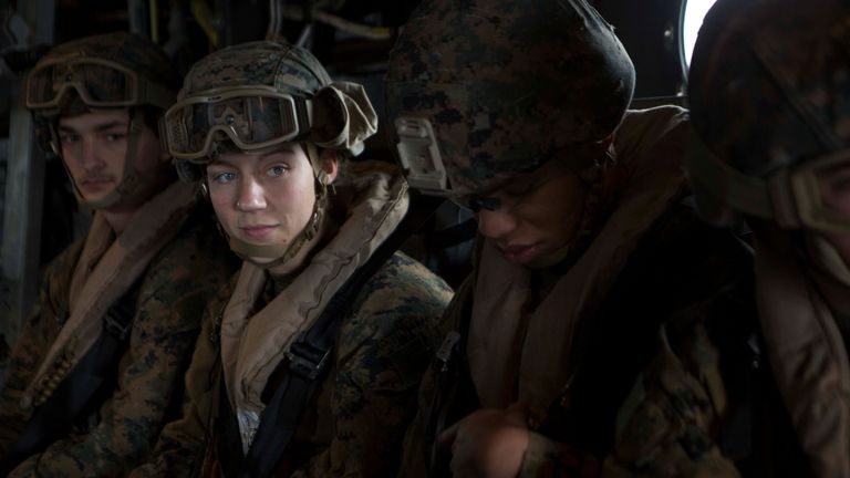 U.S. Marine Corps Corporal Nicole Gee, a maintenance technician with 24th Marine Expeditionary Unit (MEU), awaits the launch of an MV-22B Osprey during an en route care exercise aboard the Wasp-class amphibious assault ship USS Iwo Jima (LHD-7), April 5, 2021. Staff Sgt. Mark E Morrow Jr/U.S. Marine Corps/Handout via REUTERS