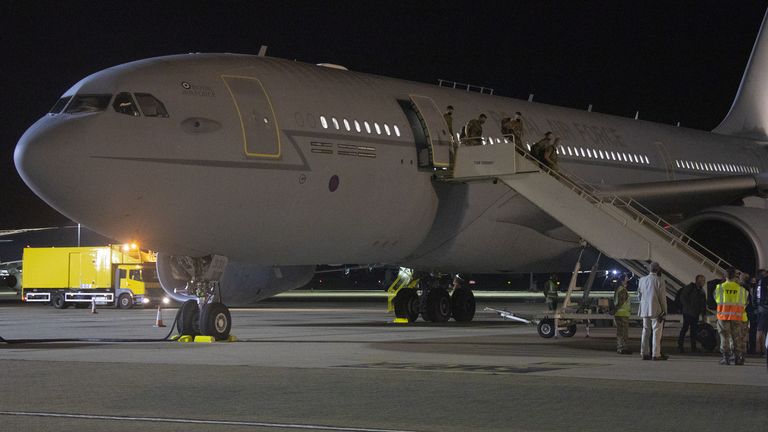 A picture issued by the Ministry of Defence of evacuated personnel arriving at RAF Brize Norton