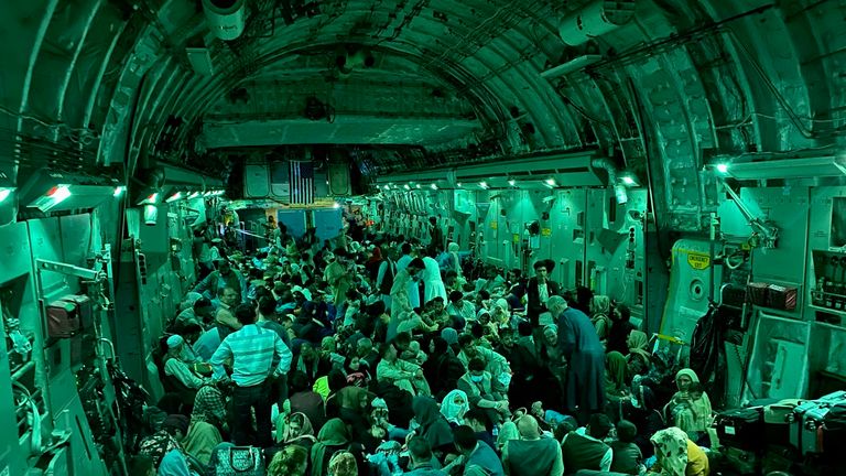 The green lights of the interior of a US Air Force C-17 after take-off from Kabul airport