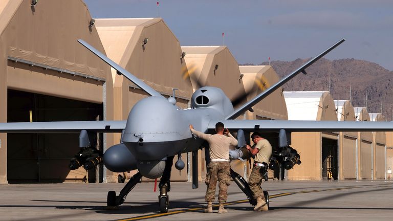 U.S. airmen prepare a U.S. Air Force MQ-9 Reaper drone as it leaves on a mission at Kandahar Air Field, Afghanistan March 9, 2016. Picture taken March 9, 2016. REUTERS/Josh Smith