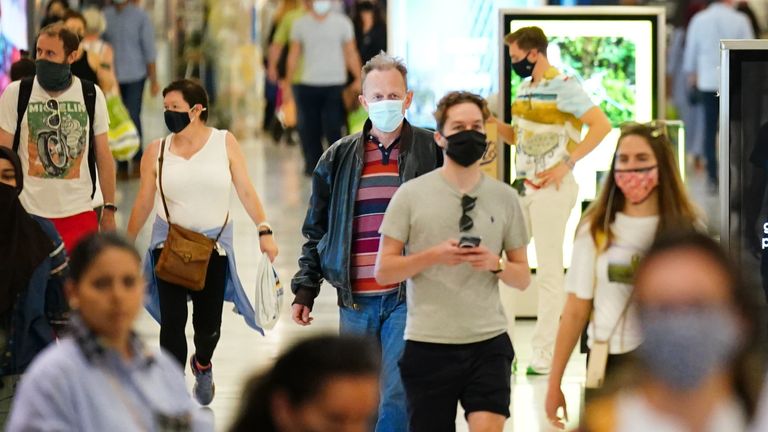 Shoppers wearing facemasks inside a shopping centre in East London, during the easing of lockdown restrictions in England. Picture date: Sunday July 4, 2021.