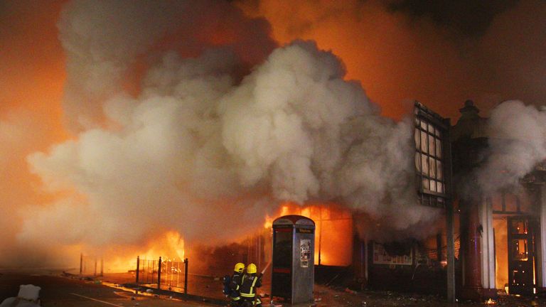 Firefighters attempt to put out a blaze in a building in Tottenham, north London