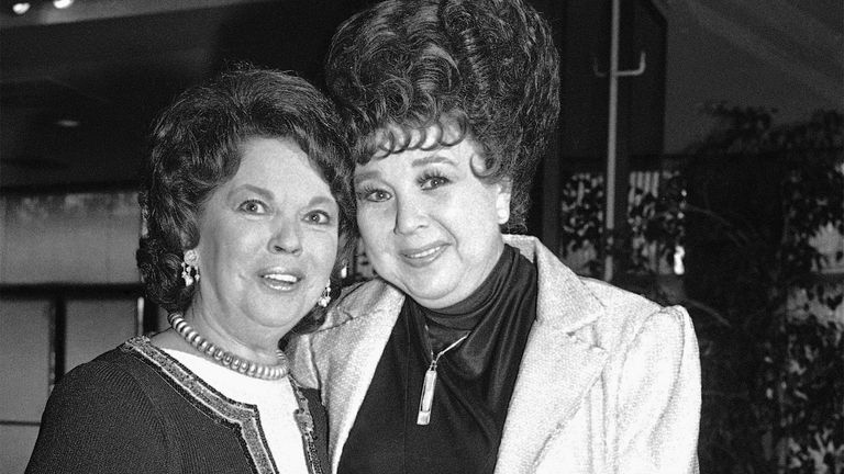 Former child actress Shirley Temple Black, left, is greeted by actress Jane Withers during a special tribute to Black presented by the Academy of Motion Pictures Arts and Sciences and the Academy Foundation, May 20, 1985 in Beverly Hills. (AP Photo/Nick Ut)