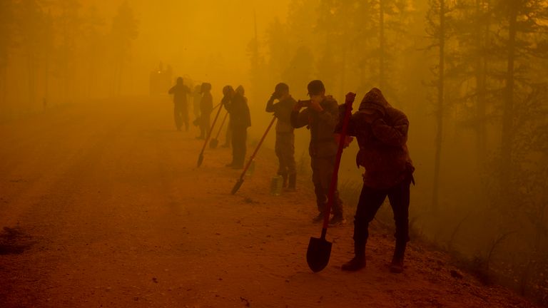 Volunteers at the forest fire site in Siberia.  Image: Ap